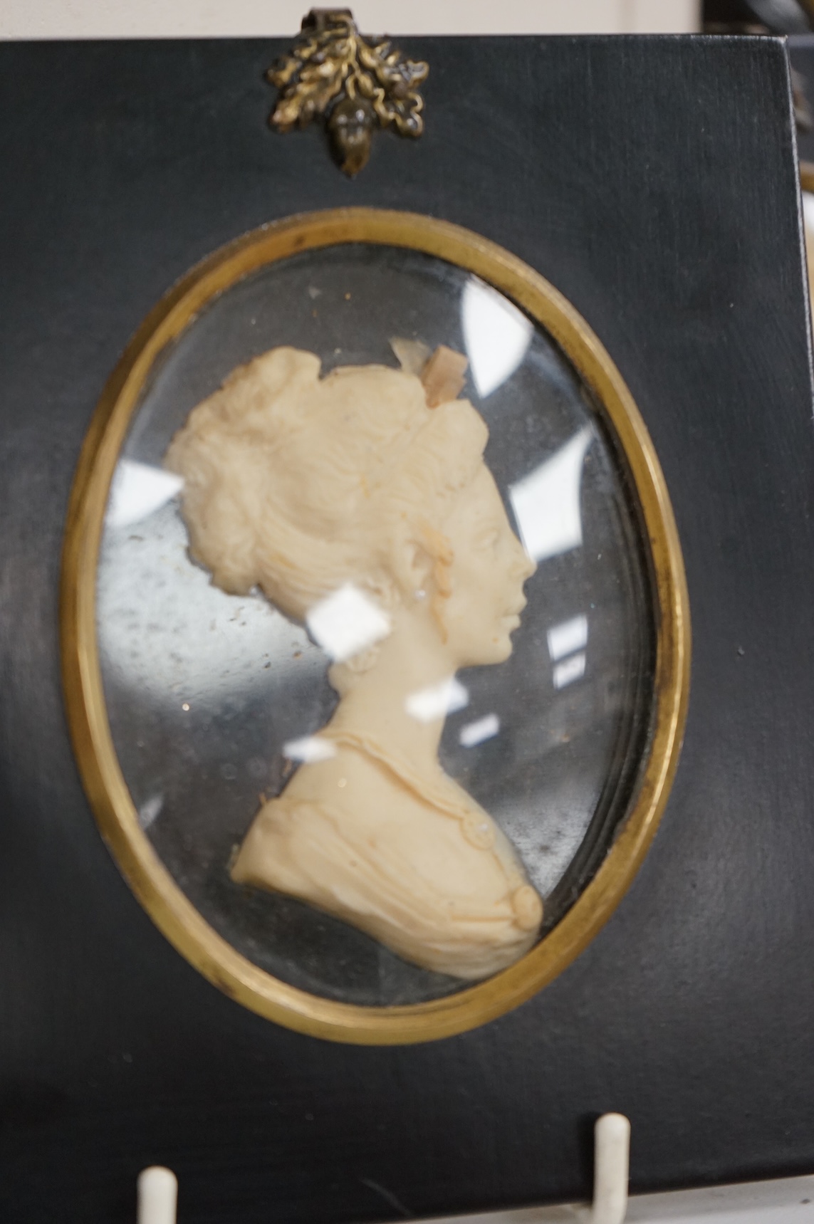 A pair of wax portrait busts by Leslie Ray depicting a Naval Officer and a lady, 16cm high